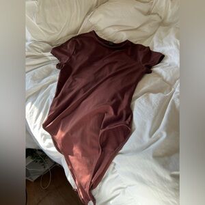 Small SHEIN brown t-shirt body suit. No rips just like brand new.